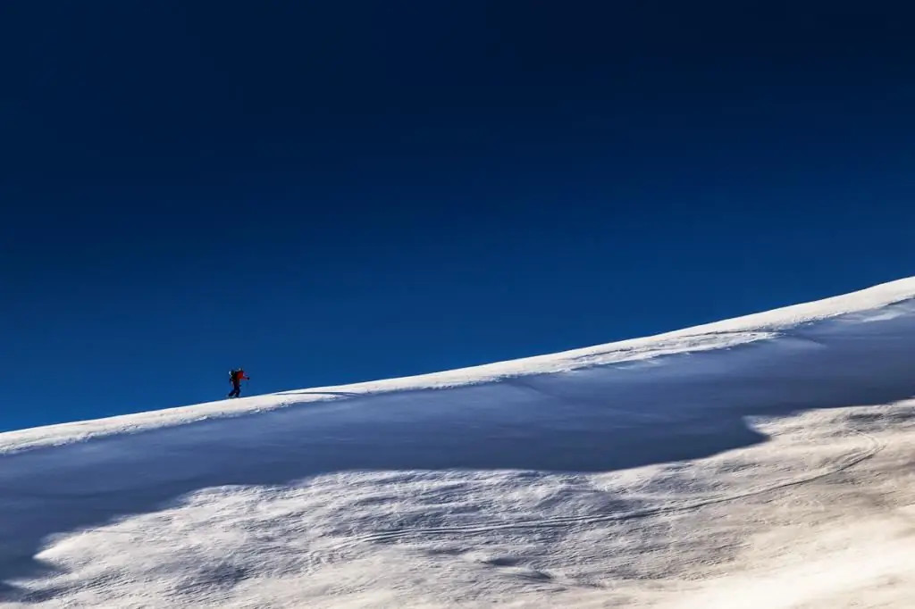 A man climbs a mountain